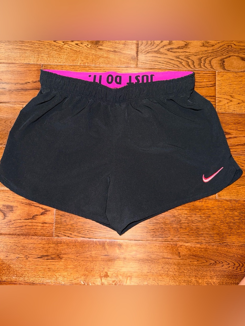 Nike Women’s Black Athletic Shorts with Pink Waistband and Logo